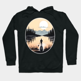 Solitary Paddleboarder in a Mountainous Sunset Scene Hoodie